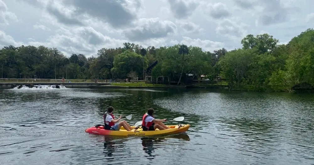 Two paddlers in a tandem kayak at De Leon Springs